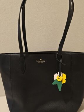 kate spade black tote with yellow and green floral charm